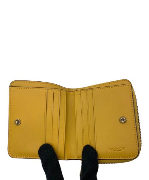 COACH（コーチ）COACH (コーチ) 2つ折り財布 イエローの古着・服飾アイテム