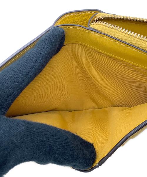 COACH（コーチ）COACH (コーチ) 2つ折り財布 イエローの古着・服飾アイテム