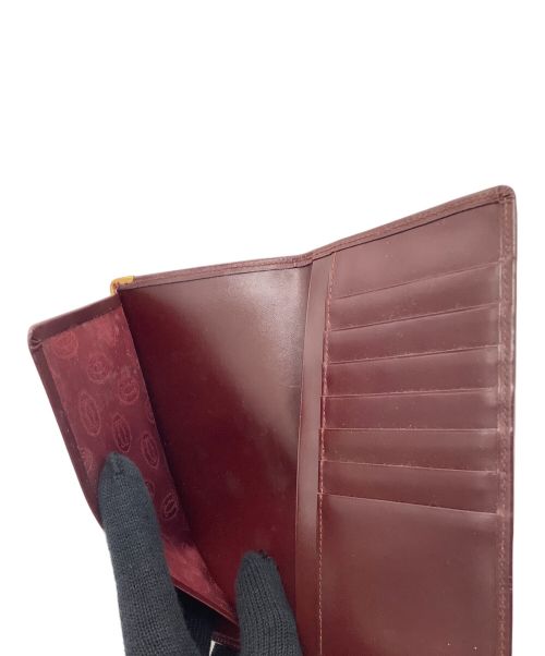 Cartier（カルティエ）Cartier (カルティエ) 札入れ ボルドーの古着・服飾アイテム