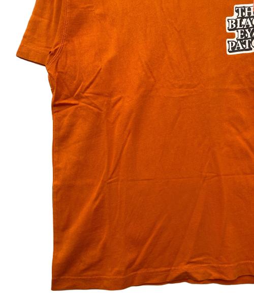 THE BLACK EYE PATCH（ブラックアイパッチ）THE BLACK EYE PATCH (ブラックアイパッチ) 半袖Tシャツ オレンジ サイズ:Ｍの古着・服飾アイテム