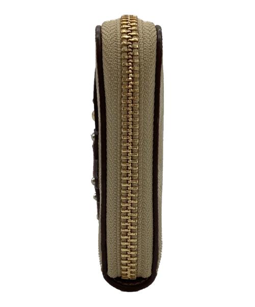 COACH（コーチ）COACH (コーチ) DISNEY (ディズニー) DISNEYコラボ シンデレラ パッチ PVC シグネチャー 長財布 ベージュの古着・服飾アイテム