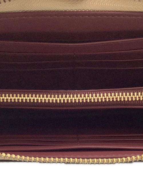 COACH（コーチ）COACH (コーチ) DISNEY (ディズニー) DISNEYコラボ シンデレラ パッチ PVC シグネチャー 長財布 ベージュの古着・服飾アイテム