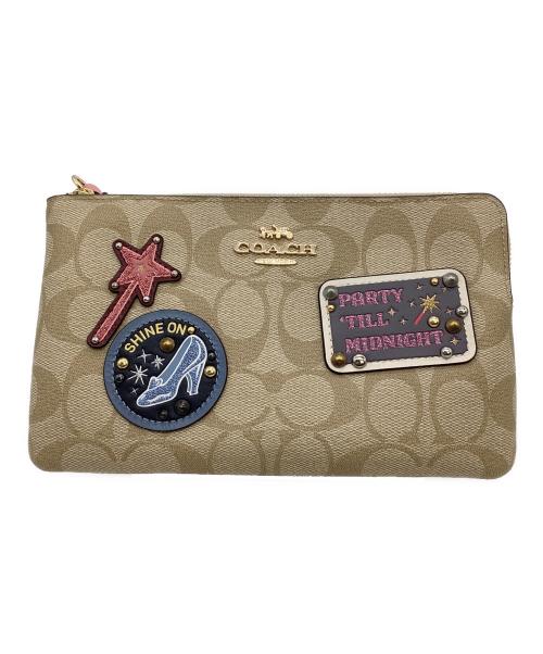 COACH（コーチ）COACH (コーチ) DISNEY (ディズニー) シンデレラパッチラージリストレットポーチ ベージュの古着・服飾アイテム