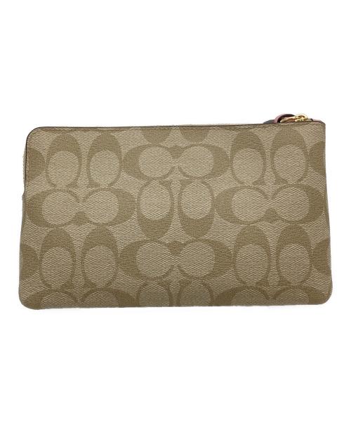 COACH（コーチ）COACH (コーチ) DISNEY (ディズニー) シンデレラパッチラージリストレットポーチ ベージュの古着・服飾アイテム