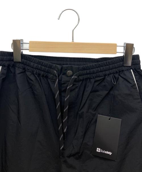 SUBCIETY（サブサエティ）SUBCIETY (サブサエティ) ナイロンパンツ ブラック サイズ:Ｌ 未使用品の古着・服飾アイテム