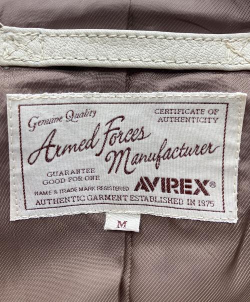 AVIREX（アヴィレックス）AVIREX (アヴィレックス) PATCHED TRUCKER JACKET ベージュ サイズ:Mの古着・服飾アイテム