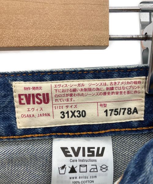 EVISU（エヴィス）EVISU (エヴィス) エクリュ大黒プリント ルーズフィット ジーンズ #2038 インディゴ サイズ:W31の古着・服飾アイテム