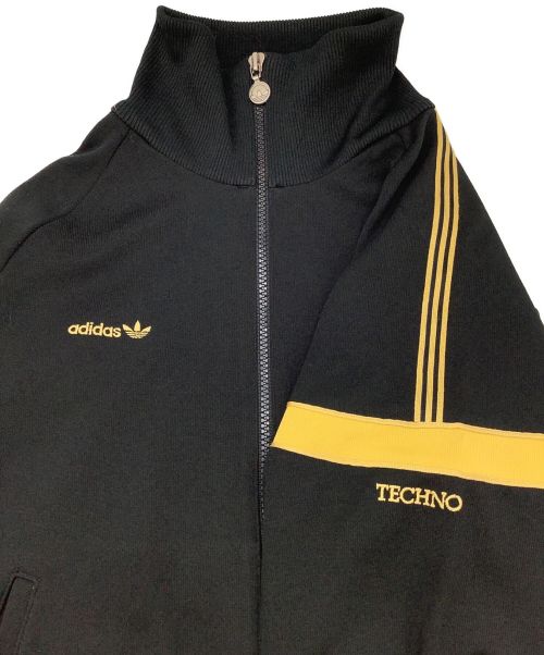 adidas（アディダス）adidas (アディダス) 80s デサント製 トラックジャケット テクノ ブラック×ゴールド サイズ:JASPO Sの古着・服飾アイテム