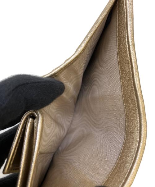 MIU MIU（ミュウミュウ）MIU MIU (ミュウミュウ) 2つ折り財布 ゴールドの古着・服飾アイテム