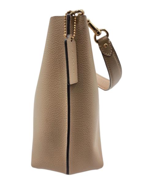 COACH（コーチ）COACH (コーチ) モリーバケットバッグ ベージュの古着・服飾アイテム