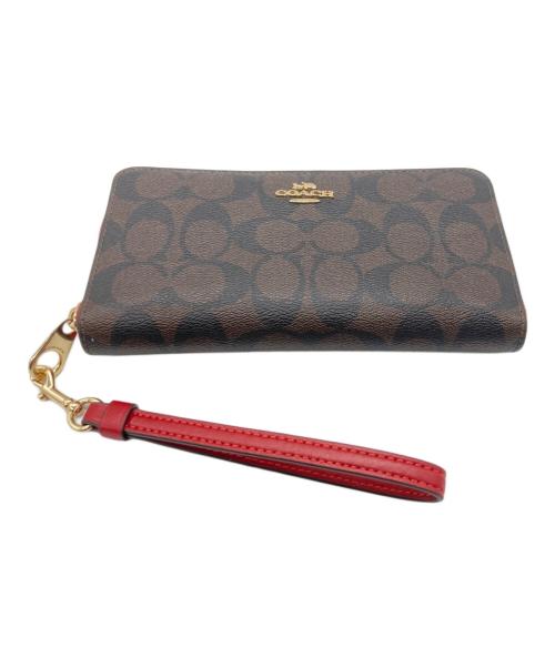 COACH（コーチ）COACH (コーチ) ラウンドファスナー財布 ブラウン×レッドの古着・服飾アイテム