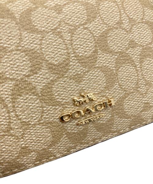 COACH（コーチ）COACH (コーチ) コンパクトウォレット ベージュ×ブラウンの古着・服飾アイテム