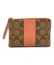 COACH（コーチ）の古着「ハンドポーチ」｜オレンジ×ベージュ