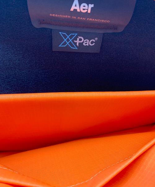 AER（エアー）AER (エアー) バックパック ブラック×オレンジの古着・服飾アイテム