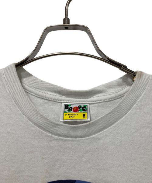 A BATHING APE（アベイシングエイプ）A BATHING APE (アベイシングエイプ) Camo Milo Busy Works Tee ホワイト サイズ:Ｍの古着・服飾アイテム