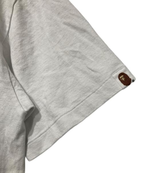 A BATHING APE（アベイシングエイプ）A BATHING APE (アベイシングエイプ) Camo Milo Busy Works Tee ホワイト サイズ:Ｍの古着・服飾アイテム