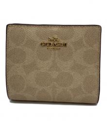 COACH（コーチ）の古着「2つ折り財布」｜ベージュ