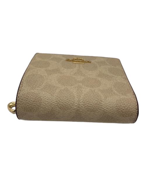 COACH（コーチ）COACH (コーチ) 2つ折り財布 ベージュの古着・服飾アイテム