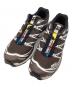 SALOMON（サロモン）の古着「ランニングシューズ」｜ブラウン