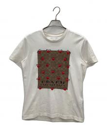 COACH（コーチ）の古着「シグネチャー ストロベリー Tシャツ」｜ホワイト