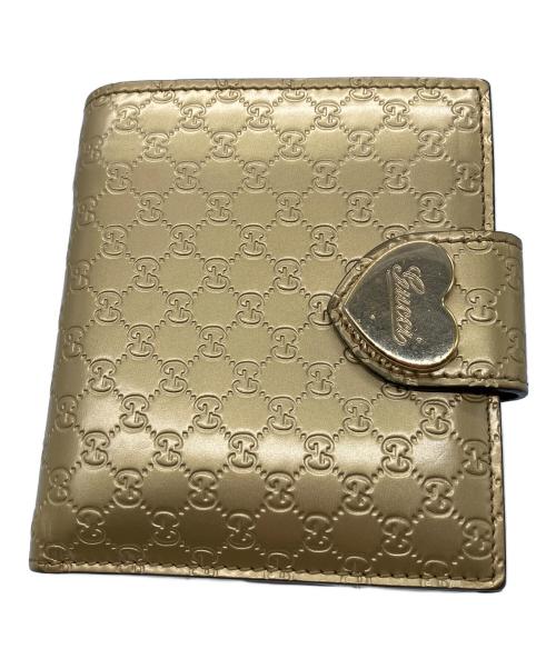 GUCCI（グッチ）GUCCI (グッチ) 2つ折り財布　GUCCI　ゴールド　GG総柄　ハートプレート ゴールドの古着・服飾アイテム