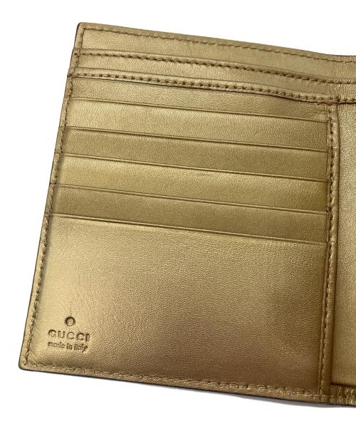 GUCCI（グッチ）GUCCI (グッチ) 2つ折り財布　GUCCI　ゴールド　GG総柄　ハートプレート ゴールドの古着・服飾アイテム