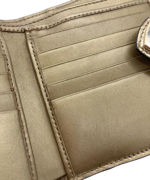 GUCCI（グッチ）GUCCI (グッチ) 2つ折り財布　GUCCI　ゴールド　GG総柄　ハートプレート ゴールドの古着・服飾アイテム