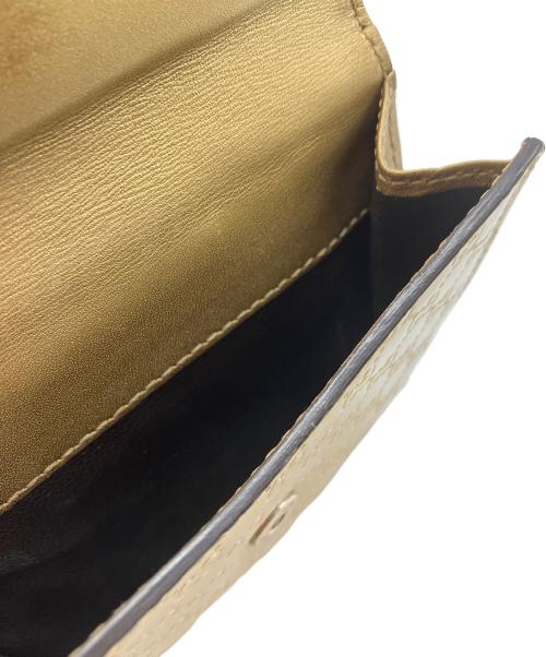 GUCCI（グッチ）GUCCI (グッチ) 2つ折り財布　GUCCI　ゴールド　GG総柄　ハートプレート ゴールドの古着・服飾アイテム