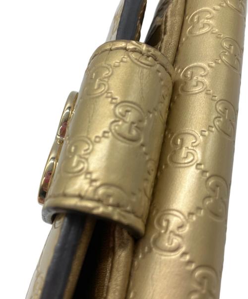 GUCCI（グッチ）GUCCI (グッチ) 2つ折り財布　GUCCI　ゴールド　GG総柄　ハートプレート ゴールドの古着・服飾アイテム