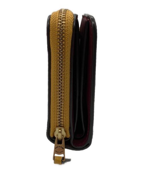 COACH（コーチ）COACH (コーチ) ラウンドファスナー財布 ブラウン×イエローの古着・服飾アイテム