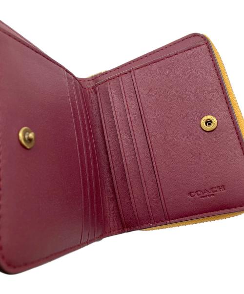 COACH（コーチ）COACH (コーチ) ラウンドファスナー財布 ブラウン×イエローの古着・服飾アイテム