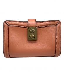 COACH（コーチ）の古着「2つ折り財布」｜ピンク