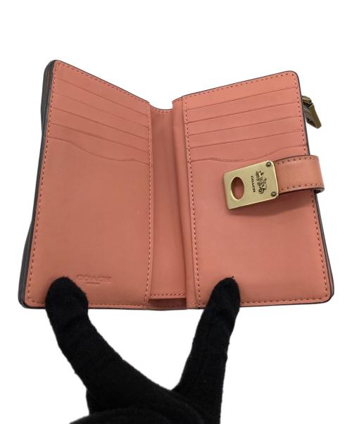 COACH（コーチ）COACH (コーチ) 2つ折り財布 ピンクの古着・服飾アイテム
