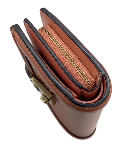 COACH（コーチ）COACH (コーチ) 2つ折り財布 ピンクの古着・服飾アイテム