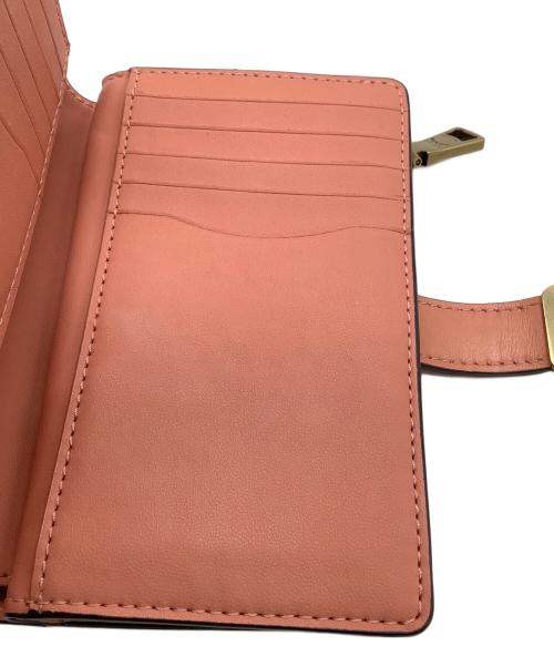 COACH（コーチ）COACH (コーチ) 2つ折り財布 ピンクの古着・服飾アイテム