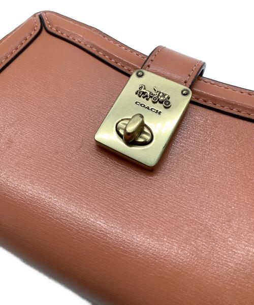 COACH（コーチ）COACH (コーチ) 2つ折り財布 ピンクの古着・服飾アイテム