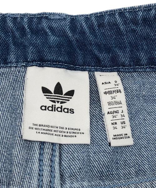 adidas（アディダス）adidas (アディダス) デニムファイヤーバードパンツ インディゴ サイズ:W34　180/86Aの古着・服飾アイテム