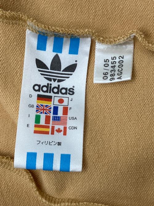 adidas（アディダス）adidas (アディダス) 80sトラックジャケット 銀タグ 万国旗タグ 古着 ベージュ×ブラウン サイズ:Lの古着・服飾アイテム