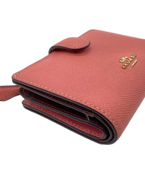 COACH（コーチ）COACH (コーチ) 2つ折り財布 ピンクの古着・服飾アイテム