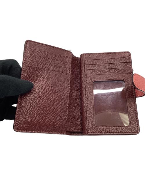 COACH（コーチ）COACH (コーチ) 2つ折り財布 ピンクの古着・服飾アイテム