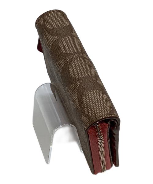 COACH（コーチ）COACH (コーチ) 2つ折り財布 ピンクの古着・服飾アイテム