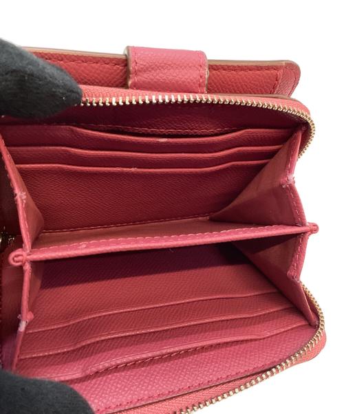 COACH（コーチ）COACH (コーチ) 2つ折り財布 ピンクの古着・服飾アイテム