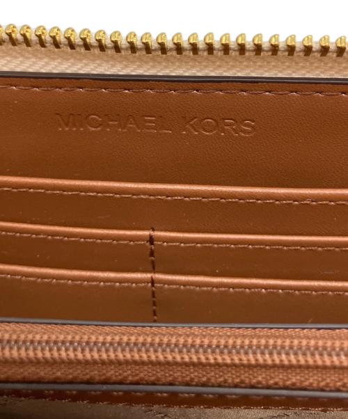 MICHAEL KORS（マイケル・コース）MICHAEL KORS (マイケル・コース) コーテッドキャンバス 長財布 ホワイトの古着・服飾アイテム