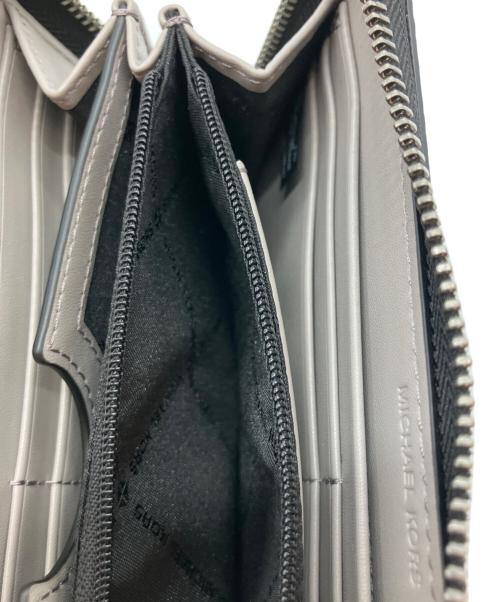 MICHAEL KORS（マイケル・コース）MICHAEL KORS (マイケル・コース) ラウンドファスナー 長財布 36S4LCOZ3L グレーの古着・服飾アイテム