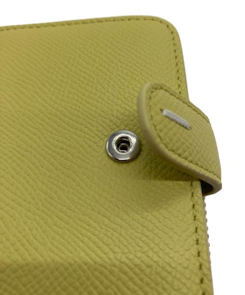 Maison Margiela（メゾンマルジェラ）Maison Margiela (メゾンマルジェラ) 4ステッチジップアラウンドコンパクトウォレット イエローの古着・服飾アイテム