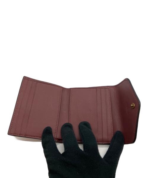 COACH（コーチ）COACH (コーチ) 花柄 2つ折り財布 ブラックの古着・服飾アイテム
