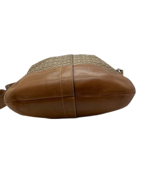COACH（コーチ）COACH (コーチ) シグネチャー 総柄 タッセル ショルダーバッグ ブラウンの古着・服飾アイテム