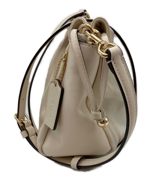 COACH（コーチ）COACH (コーチ) フェイ ドローストリングバッグ アイボリーの古着・服飾アイテム