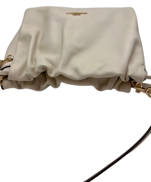 COACH（コーチ）COACH (コーチ) フェイ ドローストリングバッグ アイボリーの古着・服飾アイテム