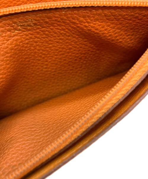 HERMES（エルメス）HERMES (エルメス) ドゴンGM D 長財布 オレンジの古着・服飾アイテム